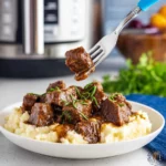 Slow cooker garlic butter beef bites served in rustic bowl